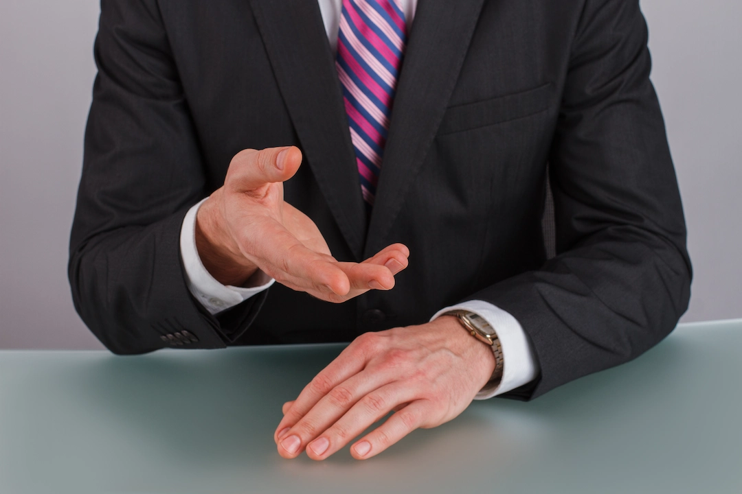 businessman-gesticulating-with-hands-close-up-2024-09-18-01-52-24-utc (1)